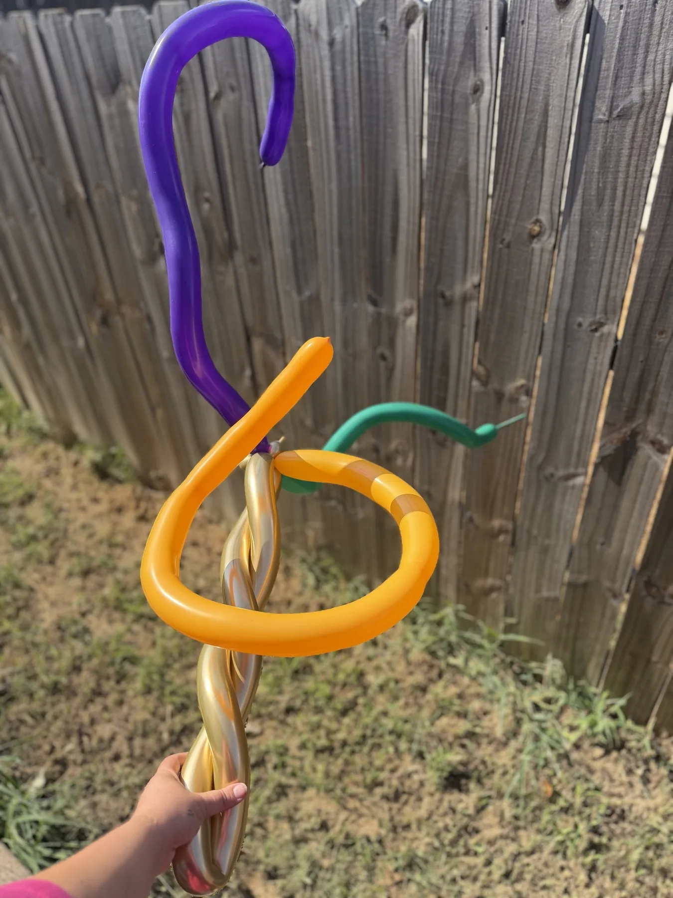 Orange and purple balloon wand for a fall festival