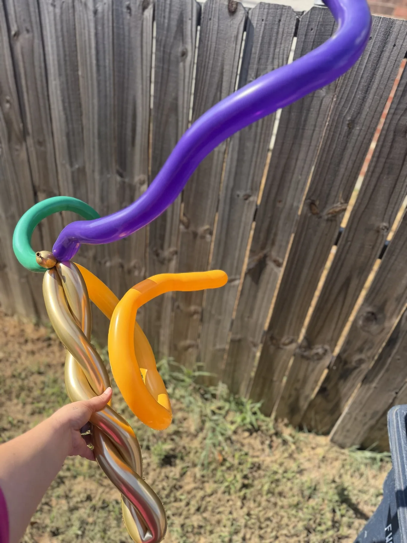 Purple orange and gold balloon wand for a fall event