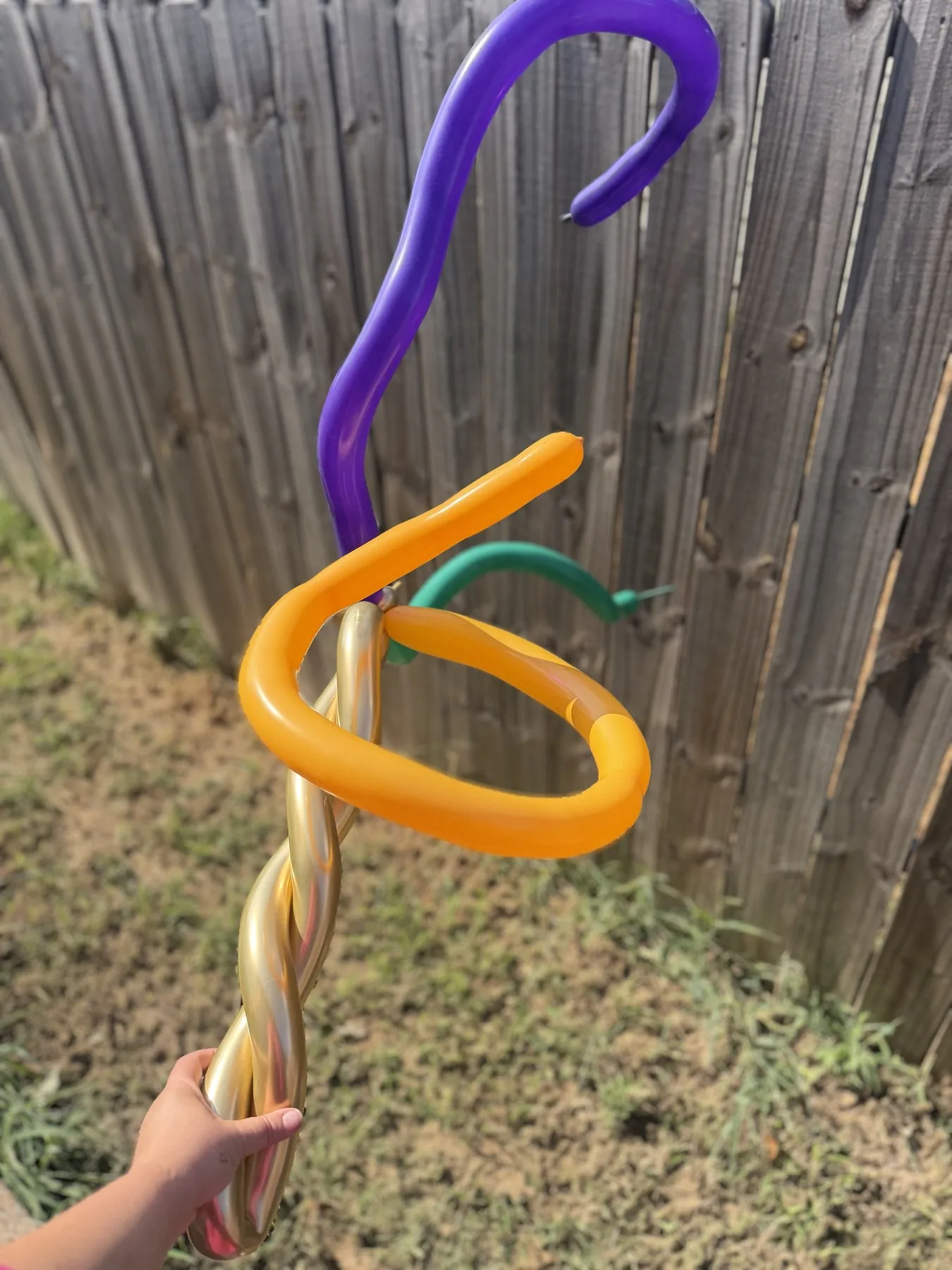 Purple and orange balloon wand made for a Halloween celebration