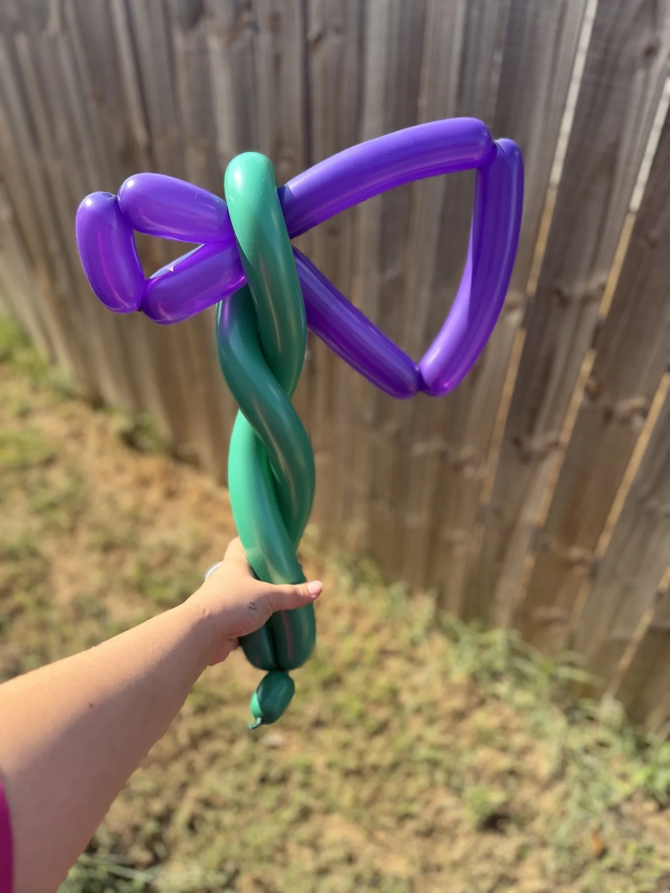 Purple and green balloon axe made for a Halloween event