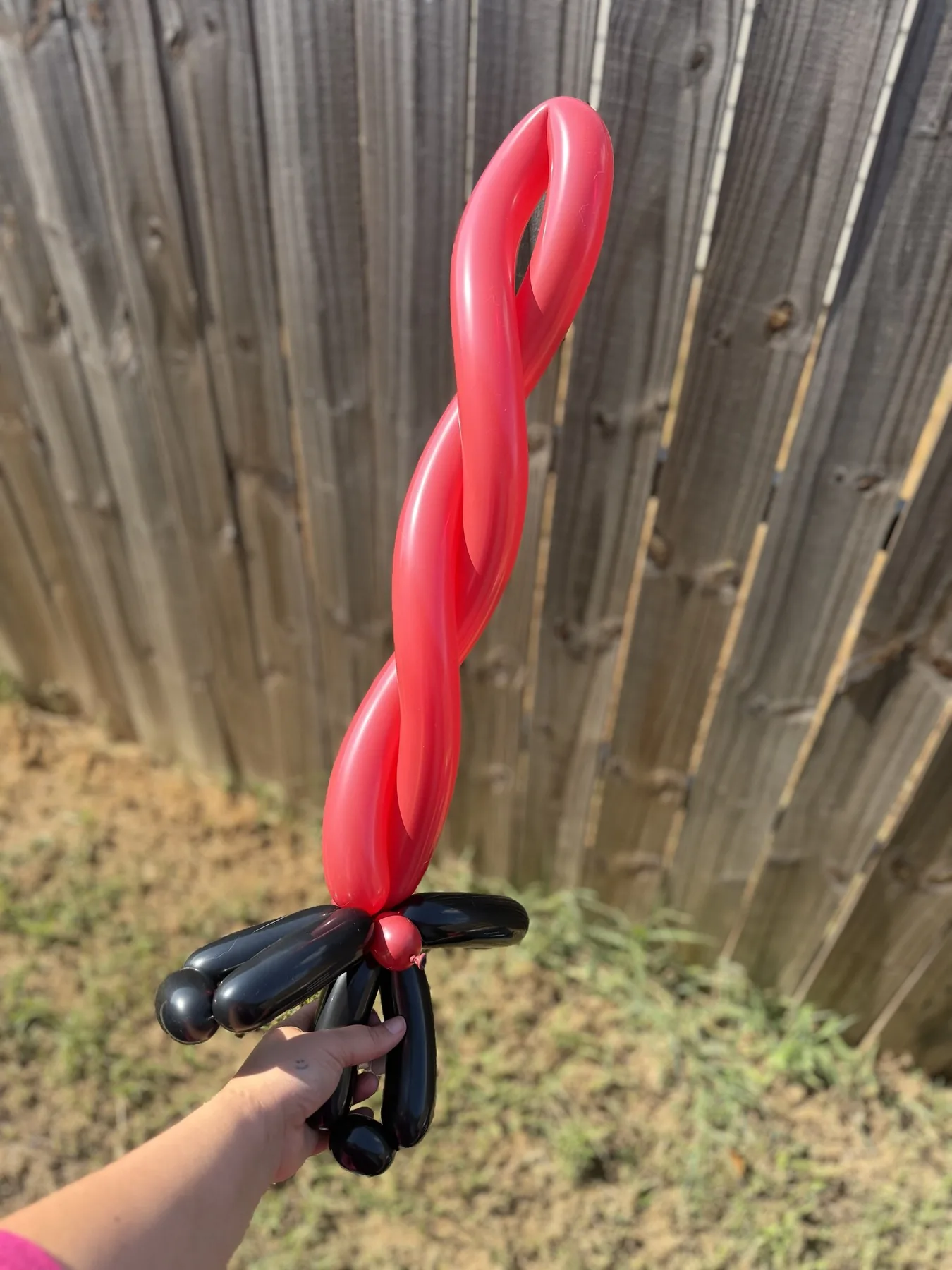 Red and black balloon sword made for a Halloween event